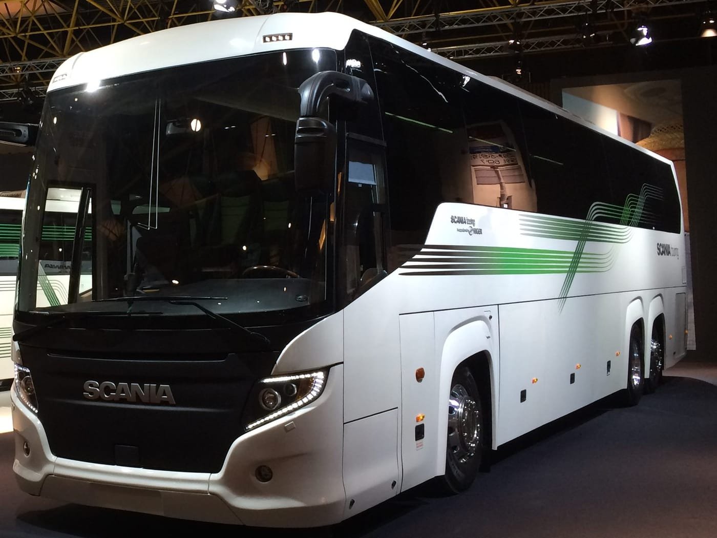 White 40-seater coach, front three-quarter view